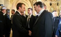 Emmanuel Macron et l'archevĂȘque de Paris Michel Aupetit au CollĂšge des Bernardins Ă  Paris, le 9 avril 2018