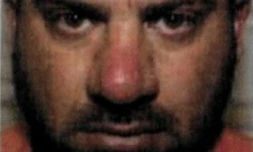 Gros plan sur le visage d'Abou Ibrahim al-Hachimi al-Qourachi, l'ex-chef du groupe Etat islamique (EI), diffusé le 17 juillet 2020 par le Département d'Etat américain