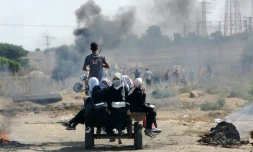 ScÚne d'affrontement entre Gazaouis et force de sécurité israéliennes au point de passage de Nahal Oz, le 10 octobre 2015