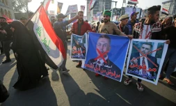 Des Irakiens manifestent contre un gouverneur de province, dans la capitale irakienne Bagdad, le 26 décembre 2019