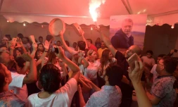 Le partisans de Nabil Karoui (portrait) célÚbrent les résultats du premier tour, à Tunis le 15 septembre 2019