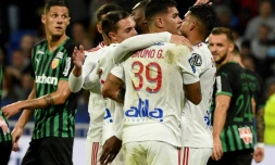 La joie des Lyonnais après l'ouverture du score par leur attaquant camerounais Karl Toko Ekambi (c) face à Lens, lors de la 12e journée de Ligue 1, le 30 octobre 2021 au Groupama Stadium