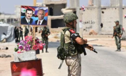 Des soldats russes et syriens au point de passage d'Abu ad Duhur, dans la province d'Idleb en Syrie, le 20 août 2018