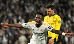 L'attaquant brésilien du Real Madrid Vinicius Junior célÚbre le but qu'il vient d'inscrire en finale de Ligue des champions contre le Borussia Dortmund, le 1er juin 2024 à Londres.