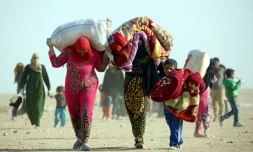 Des réfugiés irakiens qui ont fui Mossoul à Rajm Salibe, sur la frontière irako-syrienne, le 22 octobre 2016