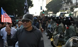 Marche organisée dans le quartier de Tsim Sha Tsui à Hong Kong le 1er décembre 2019 dans le cadre des mouvements de protestations pro-démocratie 