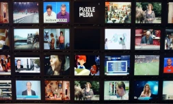 Un mur d'écrans de télévision au siège de Médiamétrie, à Paris le 30 octobre 2012