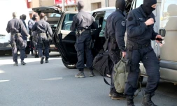 Des membres du GIGN devant le supermarché Super U de TrÚbes aprÚs une prise d'otages, le 23 mars 2018