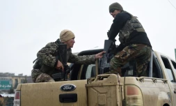 Des membres des forces de sécurité près de l'Académie militaire de Kaboul où s'est déroulé une attaque meurtrière le 29 janvier 2018