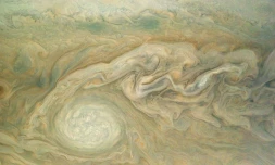 Une image diffusée le 19 mai 2017 par la Nasa illustrant les ouragans détectés par la sonde Juno sur Jupiter