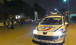 Une voiture de police sur les lieux d'une fusillade à Marseille où trois hommes ont été tués, le 3 avril 2016 