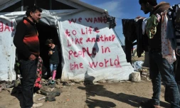 Des migrants dans le camp d'Idomeni en Grèce, le 26 mars 2016, à proximité de la frontière avec la Macédoine