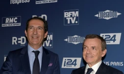 Le fondateur d'Altice Patrick Drahi (G) et le patron du groupe Altice Alain Weill le 9 octobre 2018 à Paris