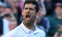 Le Serbe N.1 mondial Novak Djokovic contre l'Américain Denis Kudla au 2e tour de Wimbledon, le 3 juillet 2019 à Londres