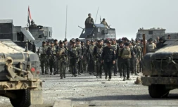 Des membres des forces spéciales irakiennes dans un quartier reconquis de Mossoul, le 27 novembre 2016 