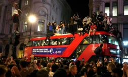 Des supporters anglais célèbrent l'accession en finale de l'Euro-2020 de leur équipe, à Londres le 7 juillet 2021