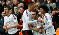 Les joueurs de Manchester United célÚbrent le but de Juan Mata (c), le 21 mai à Londres, en finale de la FA Cup
