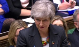 Capture écran d'une vidéo fournie par le Parlement britannique montrant la Première ministre Theresa May à la Chambre des Communes à Londres, le 12 février 2019 