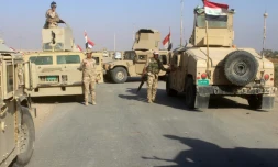 Des forces irakiennes regroupées dans la région de Rawa, dernière localité tenue par le groupe Etat islamique en Irak, le 11 novembre 2017