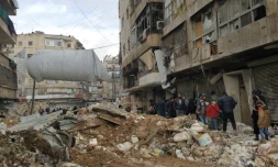 Des Syriens reviennent dans le district Bustan al-Qast d'Alep, repris par les forces progouvernementales, le 23 décembre 2016