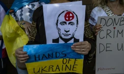 Ukrainian citizens take part in a protest in support of Ukraine in front of the Russian Embassy in Santiago, Chile, on February 26, 2022