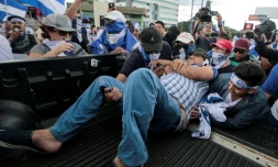 Un manifestant blessé par balle au bras lors d'une manifestation à Managua le 2 septembre 2018