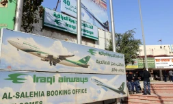 Des policiers irakiens devant une agence de voyage de Bagdad, le 29 janvier 2017