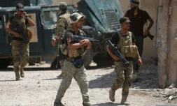 Des membres des forces gouvernementales irakiennes, le 26 juin 2016 à Fallouja