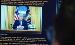 L'allocution du président américain Donald Trump diffusée sur un écran à la Bourse de New York, le 12 mars 2020