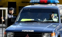 Un véhicule du département de médecine légale quitte l'hôpital de Kuala Lumpur, le 16 février 2017 où se trouve le corps de Kim Jong-Nam, demi-frère du leader nord-coréen Kim Jong-Un