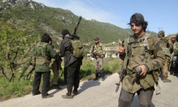 Un groupe de rebelles le 23 mars 2014  à Kassab en Syrie