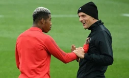 Le défenseur du PSG Presnel Kimpembe et son entraîneur Thomas Tuchel lors d'un entraînement le 2 octobre 2018 à Saint-Germain-en-Laye près de Paris 
