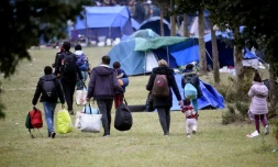 Des migrants quittent le campement de Grande-Synthe le 17 septembre 2019
