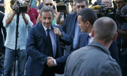 Nicolas Sarkozy arrive à son nouveau QG de campagne à Paris le 23 août 2016