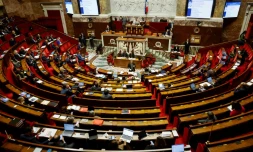 Le ministre de l'Intérieur Gérald Darmanin (c) lors des débats sur le projet de loi immigration à l'Assemblée nationale, le 7 décembre 2023 à Paris