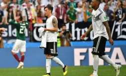 Jerome Boateng (r) has said it is unfair to single out Mesut Ozil (l) as the scapegoat for Germany's early World Cup exit.