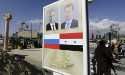 Un panneau avec des portraits du président russe Vladimir Poutine et son homologue syrien Bachar al-Assad à Palmyre, en Syrie, le 6 mai 2016