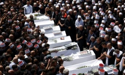 Funérailles des victimes d'une frappe imputée au Hezbollah libanais sur le plateau syrien du Golan annexé, dans la ville druze de Majdal Shams le 28 juillet 2024