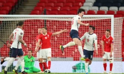 La joie du défenseur anglais Harry Maguire, aprÚs avoir marqué le 2e but pour son équipe face à la Pologne, lors de leur match de qualifications pour le Mondial-2022, le 31 mars 2021 au stade de Wembley à Londres