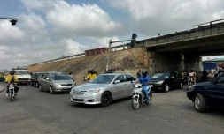 Des automobilistes à Cotonou après que des militaires ont annoncé à la télévision publique du Bénin avoir "démis de ses fonctions" le président Patrice Talon, le 7 décembre 2025
following rumors of a possible coup in the country on December 7, 2025 Benin's President Patrice Talon is safe and the army is regaining control, after a group of soldiers said they had ousted him from power, the presidency told AFP on Sunday.
"This is a small group of people who only control the television," his office said. "The regular army is regaining control. The city and the country are completely secure."