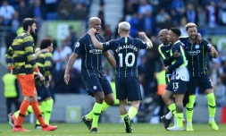 Les joueurs de Manchester City en liesse aprÚs avoir décroché le sacre de champion d'Angleterre à l'issue du match victorieux à Brighton, le 12 mai 2019