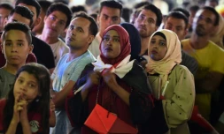 Des supporters et supportrices regardent le match de l'Egypte face à la Russie, au Caire le 19 juin 2018