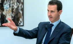 Photo transmise par l'agence officielle syrienne Sana du président Bachar al-Assad lors d'une interview, le 10 juin 2018 à Damas