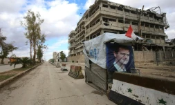 Un portrait du président syrien Bachar al-Assad sur un checkpoint à Alep, le 3 décembre 2016