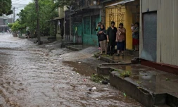 Une rue inondĂ©e aprĂšs le passage de la tempĂȘte tropicale Amanda Ă San Salvador, le 31 mai 2020