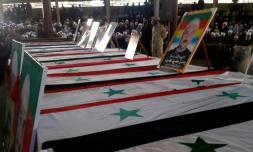 Photo diffusée par l'agence de presse officielle syrienne Sana montrant les cercueils de certaines victimes des attaques commises le 25 juillet 2018 par le groupe jihadiste Etat islamique (EI), lors de funérailles le 26 juillet 2018 dans la ville de Soueida, dans le sud de la Syrie