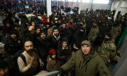 Migrants at a Belarusian logistics centre near the country's border with Poland