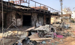 Des commerces endommagés dans la ville d'Omdurman, adjacente de Khartoum, le 30 mai 2024