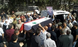 Photo diffusée le 26 juillet 2018 par l'agence de presse syrienne Sana montrant les funérailles de l'une des victimes des attaques commises le 25 juillet 2018 par l'EI dans la ville de Soueida, dans le sud de la Syrie