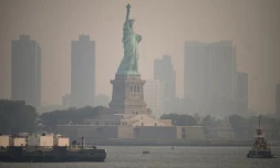 The Statue of Liberty from the Staten Island Ferry during heavy smog in New York on June 6, 2023